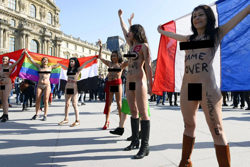 Women in Paris protest naked on International Women's Day. women. 